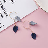 Two pairs of earrings with elegant blue acrylic and 18K gold-plated leaves, perfect for adding a touch of nature to any outfit